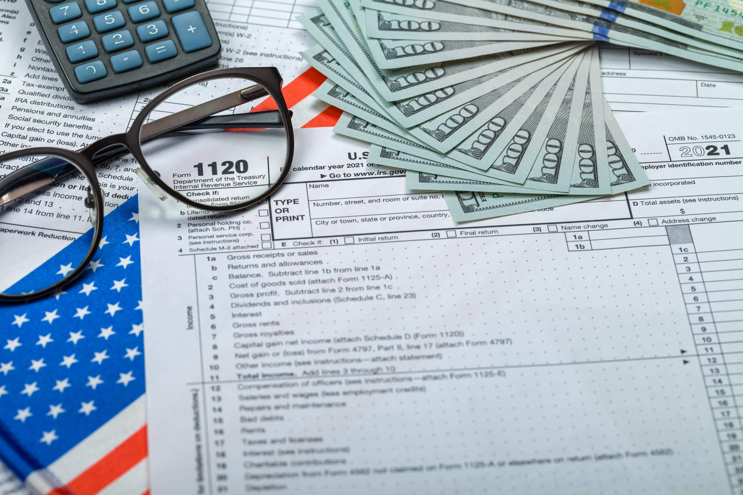 Close-up of tax documents and calculator for income tax filing